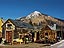 Crested Butte's famous License Plate house, home of Camp 4 Coffee, with Mt. Crested Butte in the background.