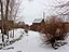 Fresh snow covers the ice over Coal Creek on a blustery winter day.