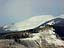 Morning fog clears over Mt. Emmons, a local peak threatened by molybdenum mining.