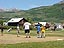 The Little League Baseball players listen attentively to their coach, as he explains where third base should be played from. 

Warm afternoon at Pitsker Field.