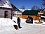 Playing outside with a friend on a clear and sunny winter day.