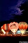 Hot air balloons taking off at dawn