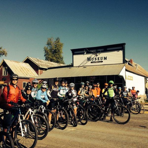 Cyclists gathering at the Crested Butte Heritage Museum for the 38th Pearl Pass Tour to Aspen…All gather to hear directions first by The legendary Don and Kay Cook! Mr. Don Cook leading the way.